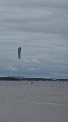 Kitesurfing and beach life in Sosnoviy Bor, nuclear plant backdrop