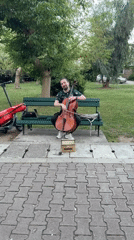 Street musician plays cello during cultural festival in Budva