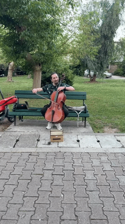 Street musician plays cello during cultural festival in Budva