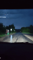 Night drive through wet roads in Gremyachinsk, Russia
