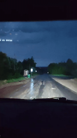 Night drive through wet roads in Gremyachinsk, Russia