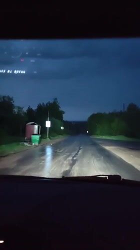 Night drive through wet roads in Gremyachinsk, Russia
