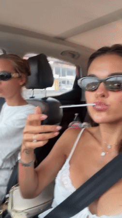 Two women travel by car in Thai district