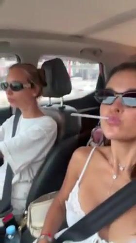 Two women travel by car in Thai district
