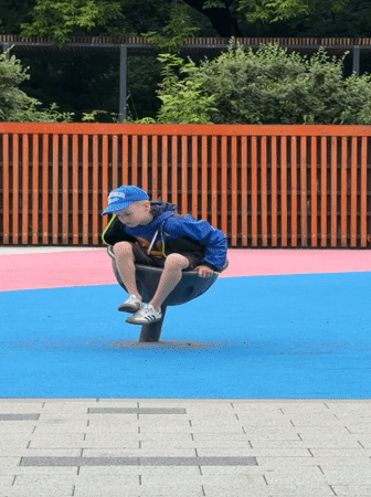 Family playground time in Moscow park
