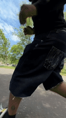 Man performs scooter tricks in sunny Lyon park