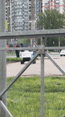 Urban life unfolds: delivery robots, crosswalks, selfies, children