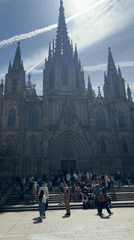Street musicians perform near Gothic cathedral in Barcelona