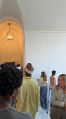 Inside a historic Milan building, people on the move