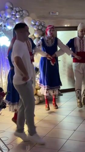 Folk dancers perform traditional Bulgarian line dance in Radomir