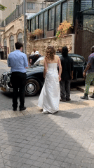 Wedding photoshoot with vintage Jaguar on Tel-Aviv cobblestone street