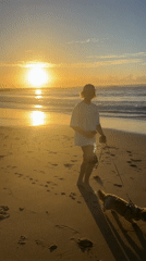 Sunrise beach activities captured at Bulli Beach, Australia