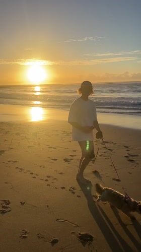Sunrise beach activities captured at Bulli Beach, Australia