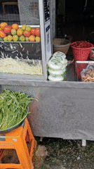 Bangkok neighborhood street life, food stalls to drainage channels