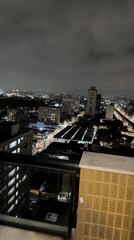 Nighttime São Paulo skyline captured from elevated viewpoint