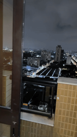 Nighttime São Paulo skyline captured from elevated viewpoint