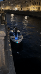 Three people observed in boat on Saint Petersburg canal