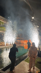 Fireworks illuminate poolside gathering in Kediri, Indonesia