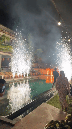 Fireworks illuminate poolside gathering in Kediri, Indonesia