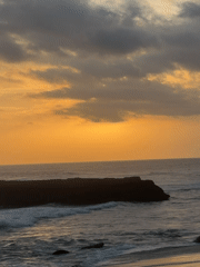 Sunset seascape with rock formation captured in North Kuta