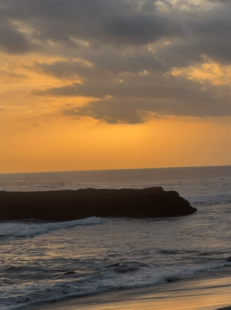 Sunset seascape with rock formation captured in North Kuta