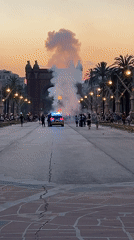 Midsummer bonfire night at Barcelona's Arc de Triomf