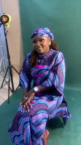 Woman conducts photo shoot in Nigerian studio