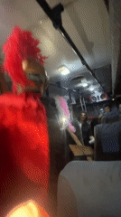 Costumed dancer performs in Roman outfit aboard Venezuela bus