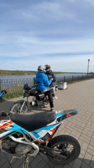 Motorcycle riders gather for outdoor recreation in Russian countryside