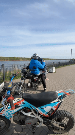 Motorcycle riders gather for outdoor recreation in Russian countryside