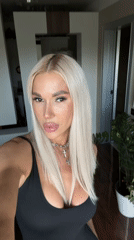 Woman takes selfie video indoors in Kazan, Russia