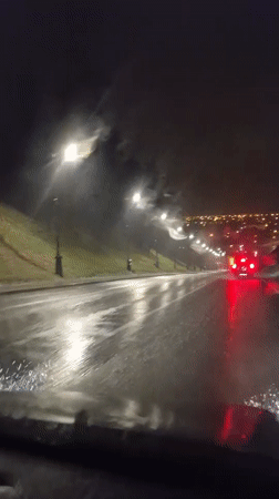 Heavy rain documented during nighttime drive in Tobolsk, Russia