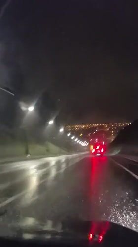 Heavy rain documented during nighttime drive in Tobolsk, Russia