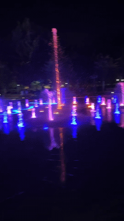 Colorful fountain light show illuminates Yerevan park at night