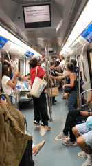 Impromptu dancing breaks out on a crowded Barcelona Metro car