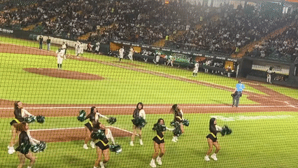 Night baseball game draws crowds, cheerleaders at Oakland Athletics stadium