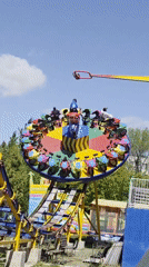 Family enjoys amusement park rides and photos in Ufa