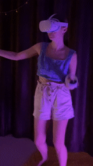 Woman uses VR headset in purple-lit room in Thailand