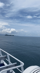 Passenger films boat deck view off Thailand coast
