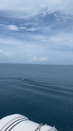 Passenger films boat deck view off Thailand coast