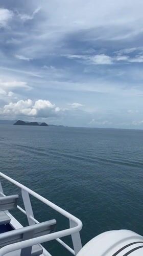 Passenger films boat deck view off Thailand coast