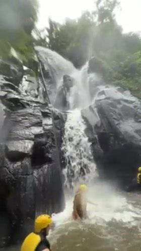 Rafting groups navigate Indonesian rapids near waterfalls in Bali