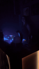 Female DJ performs at Barcelona nightclub under red lights