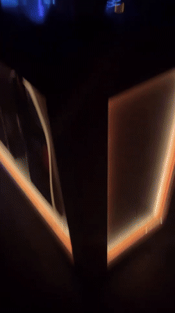 Female DJ performs at Barcelona nightclub under red lights