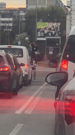 Unicyclist juggles soccer ball, bird amid Sofia traffic