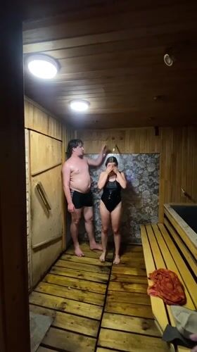 Casual sauna day outside a wooden bathhouse in Izhevsk