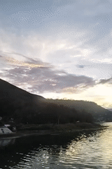 Dusk settles over a quiet lakeside promenade in Parsaoran I