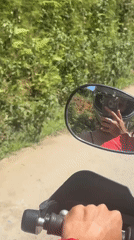 Motorcyclist takes selfie while riding in Vietnam