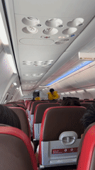 Passenger documents flight safety demo, wing views near Kuta