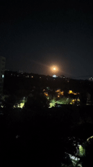 Chișinău at night: apartment blocks and a full moon